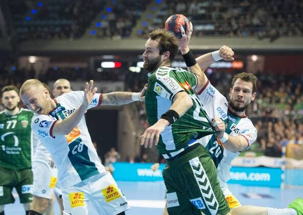 Steffen Faeth 23 B on the ball against Robert Weber 28 SCM and Mads Christiansen 20 SCM handball DHB Cup season 2017 2018 quarter finals Fuechse Berlin SC Magdeburg in Berlin Germany on 07 03 2018