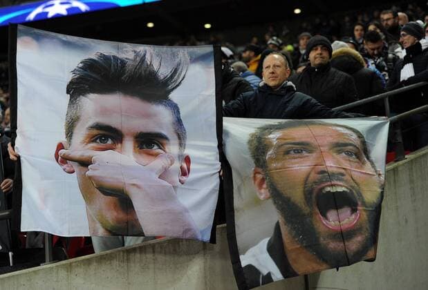 Football - 2017 2018 UEFA Champions League - Round of Sixteen, Second Leg: Tottenham Hotspur (2) vs. Juventus (2) Italian fans with banners of Gonzalo Higuain and Paulo Dybala, at Wembley Stadium. COLORSPORT ANDREW COWIE 