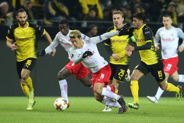 SOCCER - EL, Dortmund vs RBS DORTMUND,GERMANY,08.MAR.18 - SOCCER - UEFA Europa League, last sixteen, Borussia Dortmund vs Red Bull Salzburg. Image shows Hee Chan Hwang (RBS) and Mahmoud Dahoud (Dortmund). GEPAxpictures xMathiasxMandl