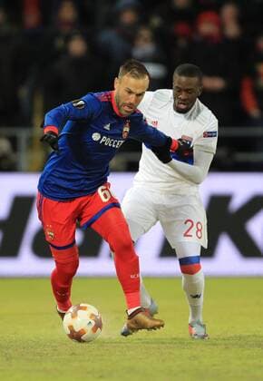 MOSCOW, RUSSIA â€“ MARCH 8, 2018: CSKA Moscow s Bibras Natkho (L) and Lyon s Tanguy Ndombele fight for the ball in the first leg of their 2017 18 UEFA Europa League Round of 16 football match at VEB Arena Stadium. Sergei Bobylev TASS  TS077122