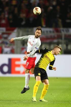 SOCCER - EL, Dortmund vs RBS DORTMUND,GERMANY,08.MAR.18 - SOCCER - UEFA Europa League, last sixteen, Borussia Dortmund vs Red Bull Salzburg. Image shows Andreas Ulmer (RBS) and Marco Reus (Dortmund). GEPAxpictures xMathiasxMandl