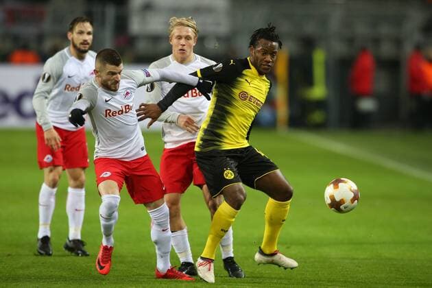 SOCCER - EL, Dortmund vs RBS DORTMUND,GERMANY,08.MAR.18 - SOCCER - UEFA Europa League, last sixteen, Borussia Dortmund vs Red Bull Salzburg. Image shows Valon Berisha (RBS) and Michy Batshuayi (Dortmund). GEPAxpictures xMathiasxMandl