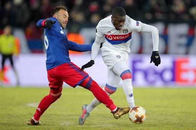 MOSCOW, RUSSIA â€“ MARCH 8, 2018: CSKA Moscow s Bibras Natkho (L) and Lyon s Tanguy Ndombele fight for the ball in the first leg of their 2017 18 UEFA Europa League Round of 16 football match at VEB Arena Stadium. Sergei Bobylev TASS  TS077124