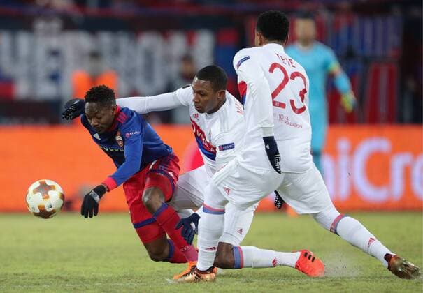 MOSCOW, RUSSIA â€“ MARCH 8, 2018: CSKA Moscow s Ahmed Musa and Lyon s Marcelo, Kenny Tete (L-R) fight for the ball in the first leg of their 2017 18 UEFA Europa League Round of 16 football match at VEB Arena Stadium. Sergei Bobylev TASS  TS077127