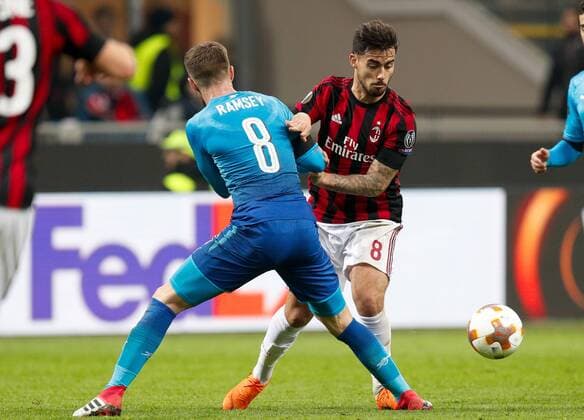 Suso of Ac Milan against Aaron Ramsey of Arsenal during the UEFA Europa League Round of 16 match between AC Milan and Arsenal at Stadio San Siro, Milan, Italy on 8 March 2018. Copyright: xRobertoxBreganix 19210022