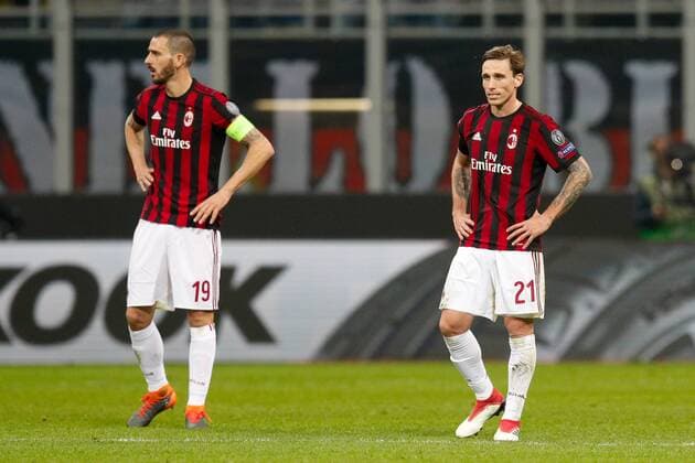 Lucas Biglia of Ac Milan and Leonardo Bonucci of Ac Milan look dejected during the UEFA Europa League Round of 16 match between AC Milan and Arsenal at Stadio San Siro, Milan, Italy on 8 March 2018. Copyright: xRobertoxBreganix 19210027