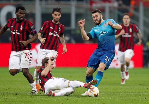 Sead Kolasinac of Arsenal against Lucas Biglia of Ac Milan during the UEFA Europa League Round of 16 match between AC Milan and Arsenal at Stadio San Siro, Milan, Italy on 8 March 2018. Copyright: xRobertoxBreganix 19210029