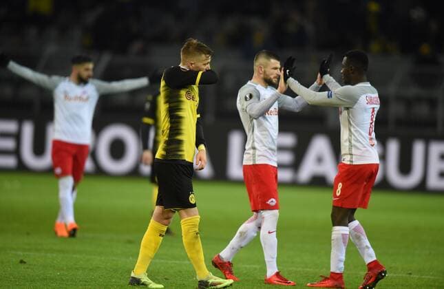 EL 1 8 Final Borussia Dortmund RB Salzburg 08 03 2018 Marco Reus disappointed after the game behind them celebrate the Salzburg HM