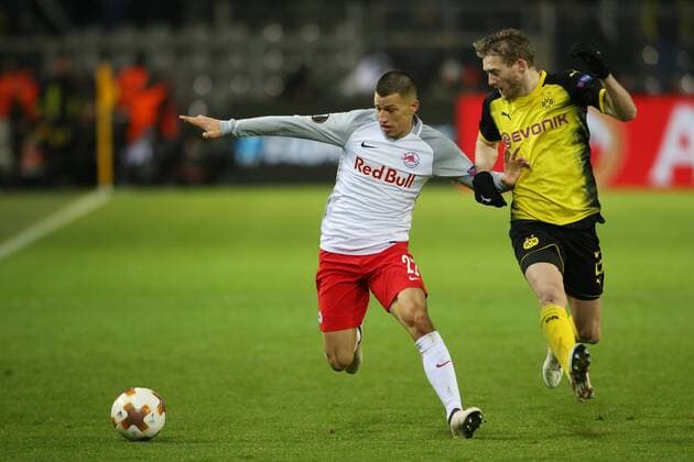 SOCCER - EL, Dortmund vs RBS DORTMUND,GERMANY,08.MAR.18 - SOCCER - UEFA Europa League, last sixteen, Borussia Dortmund vs Red Bull Salzburg. Image shows Stefan Lainer (RBS) and Andre Schuerrle (Dortmund). GEPAxpictures xMathiasxMandl