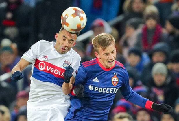 MOSCOW, RUSSIA â€“ MARCH 8, 2018: Lyon s Kenny Tete (L) and CSKA Moscow s Konstantin Kuchayev fight for the ball in their 2017 18 UEFA Europa League Round of 16 football match at VEB Arena Stadium. Lyon won the game 1-0. Sergei Bobylev TASS  TS07713D