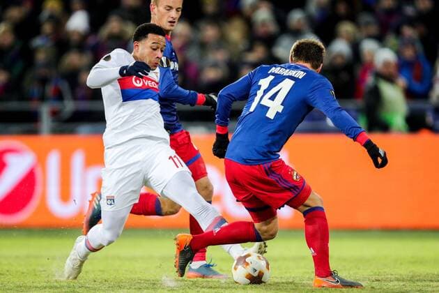 MOSCOW, RUSSIA â€“ MARCH 8, 2018: Lyon s Memphis Depay and CSKA Moscow s Konstantin Kuchayev, Kirill Nababkin (L-R) fight for the ball in their 2017 18 UEFA Europa League Round of 16 football match at VEB Arena Stadium. Lyon won the game 1-0. Sergei Bobylev TASS  TS077140