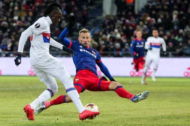 MOSCOW, RUSSIA â€“ MARCH 8, 2018: Lyon s Bertrand Traore (L) and CSKA Moscow s Alexei Berezutsky fight for the ball in their 2017 18 UEFA Europa League Round of 16 football match at VEB Arena Stadium. Lyon won the game 1-0. Sergei Bobylev TASS  TS077143