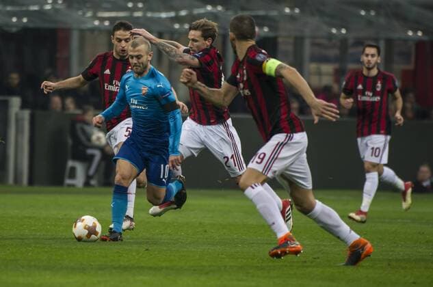 8th March 2018, San Siro, Milan, Italy; UEFA Europa League football, round of 16, 1st leg, AC Milan versus Arsenal FC; Jack Wilshere of Arsenal takes on Lucas Biglia of AC Milan  ActionPlus11999344