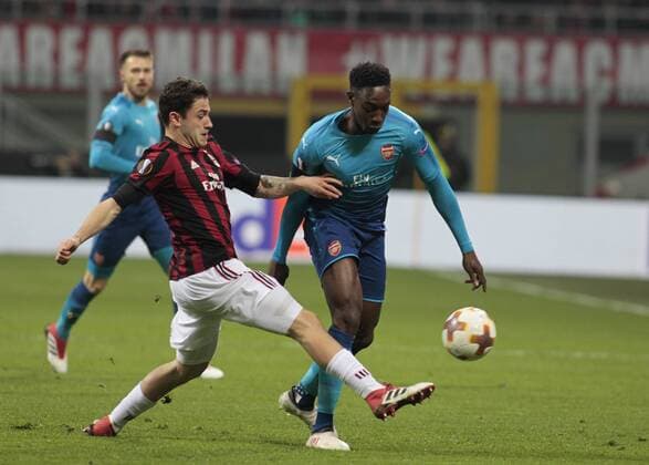March 8, 2018 - Milan, Italy - DAVIDE CALABRIA, at left, vies for ball during the first leg of the round 16 of the UEFA Europa League 2017 18 between AC Milan and Arsenal FC at Giuseppe Meazza stadium. Soccer 2018: Arsenal 2:0 AC Milan: UEFA  - ZUMAn230 20180308_zaa_n230_264 Copyright: xLorisxRosellix
