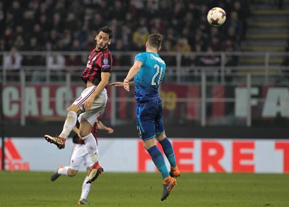 March 8, 2018 - Milan, Italy - Hakan Calhanoglu of Milan AC during the UEFA Europa League Round of 16 match between AC Milan and Arsenal at the San Siro on March 8, 2018 in Milan, Italy. AC Milan v Arsenal - UEFA Europa League Round of 16: First Leg  - ZUMAn230 20180308_zaa_n230_656 Copyright: xLorisxRosellix