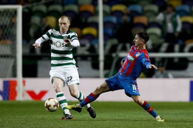 March 8, 2018 - Lisbon, Portugal - Sporting s defender Jeremy Mathieu (L) vies for the ball with Plzen s midfielder Milan Petrzela (R) during UEFA Europa League football match between Sporting CP vs FC Viktoria Plzen, in Lisbon, on March 8, 2018. Sporting Lisbon v Viktoria Plzen - UEFA Europa League Round of 16: First Leg  - ZUMAn230 20180308_zaa_n230_706 Copyright: xCarlosxPalmax