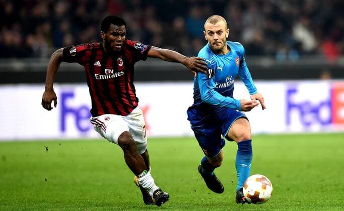 (180309) -- MILAN, March 9, 2018 -- AC Milan s Frank Kessie (L) competes with Arsenal s Jack Wilshere during a Europa League round of 16 first leg soccer match between AC Milan and Arsenal at the San Siro stadium in Milan, Italy, March 8, 2018. Arsenal won 2-0. ) (SP)ITALY-MILAN-EUROPA LEAGUE-AC MILAN VS ARSENAL AlbertoxLingria 