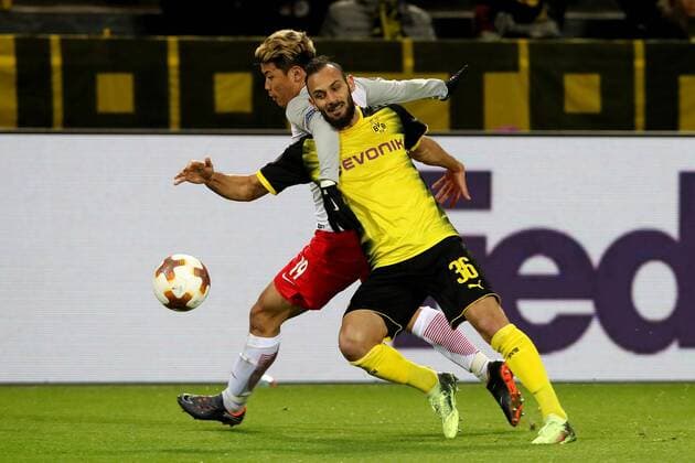 (180309) -- DORTMUND, March 9, 2018 -- Omer Toprak (R) of Dortmund vies with Hwang Hee-chan of Salzburg during the UEFA Europa League round of 16 first leg match between Germany s Borussia Dortmund and Austria s FC Red Bull Salzburg at the Signal Iduna Park in Dortmund, Germany, on March 8, 2018. FC Red Bull Salzburg won 2-1. ) (SP)GERMANY-DORTMUND-EUROPA LEAGUE-BVB VS SALZBURG JoachimxBywaletz 