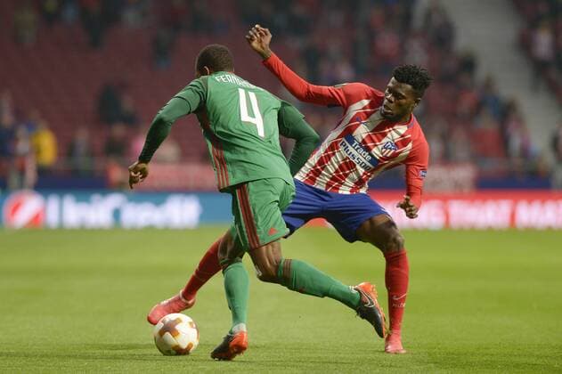 March 8, 2018 - Madrid, Spain - Thomas Partey of Atletico de Madrid figth the ball with Fernandes during UEFA Europa League Round of 16 match between Atletico Madrid and FC Lokomotiv at the Wanda Metropolitano on March 08, 2018 in Madrid, Spain. ChakanaNews-Pressouth Atletico Madrid v Lokomotiv Moscow - UEFA Europa League Round of 16: First Leg  - ZUMAn230 20180308_zaa_n230_1050 Copyright: xPatricioxRealpex