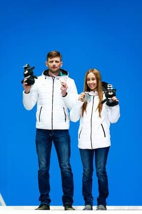 PYEONGCHANG, SOUTH KOREA - MARCH 13, 2018: Second-placed neutral Paralympic athlete (NPA) from Russia Mikhalina Lysova (R) guided by Alexei Ivanov attends a ceremony to award the visually impaired women s 10km biathlon race winners at the 2018 Winter Paralympic Games. Vladimir Smirnov TASS  TS077730