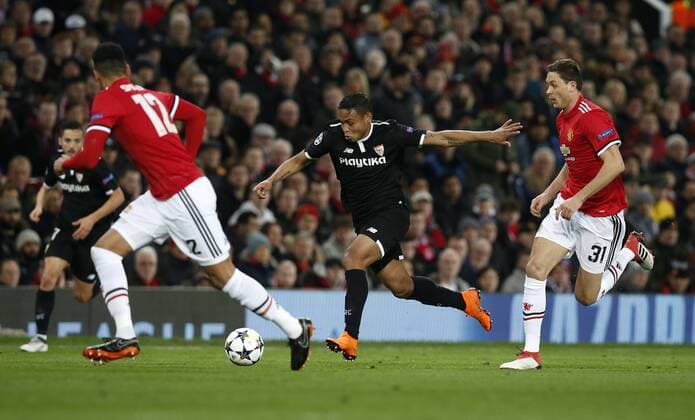 Ever Banega of Sevilla runs past Nemanja Matic of Manchester United ManU to have a shoot during the Champions League Round of 16 match at Old Trafford Stadium, Manchester. Picture date: March 13th 2018. Picture credit should read: Andrew Yates Sportimage EDITORIAL USE ONLY. No use with unauthorised audio, video, data, fixture lists, club league logos or live services. Online in-match use limited to 120 images, no video emulation. No use in betting, games or single club league player publications.