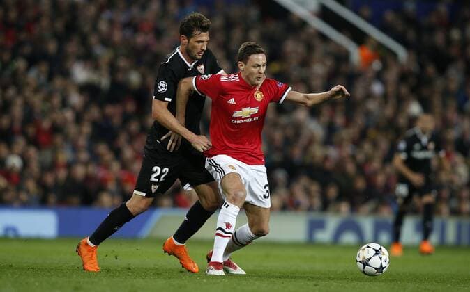 Franco Vazquez of Sevilla and Nemanja Matic of Manchester United ManU during the Champions League Round of 16 match at Old Trafford Stadium, Manchester. Picture date: March 13th 2018. Picture credit should read: Andrew Yates Sportimage EDITORIAL USE ONLY. No use with unauthorised audio, video, data, fixture lists, club league logos or live services. Online in-match use limited to 120 images, no video emulation. No use in betting, games or single club league player publications.