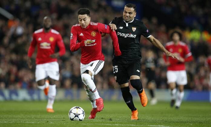 Jesse Lingard of Manchester United ManU and Gabriel Mercado of Sevilla during the Champions League Round of 16 match at Old Trafford Stadium, Manchester. Picture date: March 13th 2018. Picture credit should read: Andrew Yates Sportimage EDITORIAL USE ONLY. No use with unauthorised audio, video, data, fixture lists, club league logos or live services. Online in-match use limited to 120 images, no video emulation. No use in betting, games or single club league player publications.