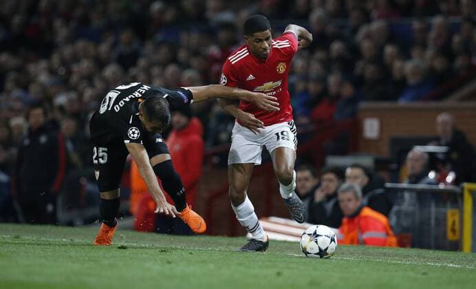 Marcus Rashford of Manchester United ManU and Gabriel Mercado of Sevilla during the Champions League Round of 16 match at Old Trafford Stadium, Manchester. Picture date: March 13th 2018. Picture credit should read: Andrew Yates Sportimage EDITORIAL USE ONLY. No use with unauthorised audio, video, data, fixture lists, club league logos or live services. Online in-match use limited to 120 images, no video emulation. No use in betting, games or single club league player publications.