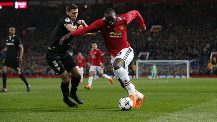 Clement Lenglet of Sevilla and Romelu Lukaku of Manchester United ManU during the Champions League Round of 16 match at Old Trafford Stadium, Manchester. Picture date: March 13th 2018. Picture credit should read: Andrew Yates Sportimage EDITORIAL USE ONLY. No use with unauthorised audio, video, data, fixture lists, club league logos or live services. Online in-match use limited to 120 images, no video emulation. No use in betting, games or single club league player publications.
