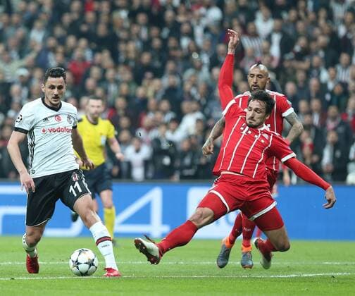 Mustafa Pektemek (L) of Besiktas and Mats Hummels (R) of Bayern Munchen during the Champions league second leg match between Besiktas and Bayern Munchen at Vodafone Park in Istanbul , Turkey on March 14 , 2018. 