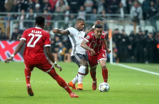 Bayern Munich™s Thiago Alcantara and Besiktas Jeremain Lens during Besiktas - Bayern Munich UEFA Champions League round of 16 second leg soccer match in Vodafone Arena, Istanbul, Turkey, Mar 14, 2018.  Copyright: TolgaxAdanali 15949805