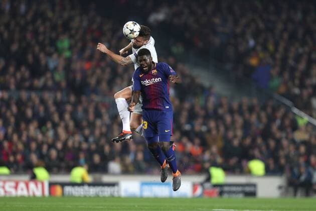 March 14, 2018 - Barcelona, Spain - OLIVIER GIROUD of Chelsea FC heads the ball under pressure from SAMUEL UMTITI of FC Barcelona Barca during the UEFA Champions League, round of 16, 2nd leg football match between FC Barcelona and Chelsea FC on March 14, 2018 at Camp Nou stadium in Barcelona, Spain Football - UEFA Champions League - FC Barcelona vs Chelsea FC  - ZUMAb169 20180314_zaa_b169_016 Copyright: xManuelxBlondeau Aop.Pressx