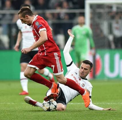 (180315) -- ISTANBUL, March 15, 2018 -- Franck Ribery (L) of Bayern Munich vies with Oguzhan Ozyakup of Besiktas during the 2017-2018 UEFA Champions League round of 16 second leg soccer match between Turkey s Besiktas and Germany s Bayern Munich in Istanbul, Turkey, on March 14, 2018. Bayern Munich won 3-1 and was qualified for quarterfinals. ) (SP)TURKEY-ISTANBUL-SOCCER-UEFA CHAMPIONS LEAGUE-BESIKTAS VS BAYERN MUNICH HexCanling 