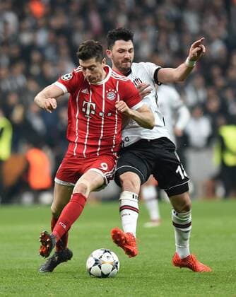 (180315) -- ISTANBUL, March 15, 2018 -- Robert Lewandowski (L) of Bayern Munich vies with Tolgay Arslan of Besiktas during the 2017-2018 UEFA Champions League round of 16 second leg soccer match between Turkey s Besiktas and Germany s Bayern Munich in Istanbul, Turkey, on March 14, 2018. Bayern Munich won 3-1 and was qualified for quarterfinals. ) (SP)TURKEY-ISTANBUL-SOCCER-UEFA CHAMPIONS LEAGUE-BESIKTAS VS BAYERN MUNICH HexCanling 