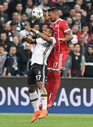 (180315) -- ISTANBUL, March 15, 2018 -- Jerome Boateng (R) of Bayern Munich vies with Jeremain Lens of Besiktas during the 2017-2018 UEFA Champions League round of 16 second leg soccer match between Turkey s Besiktas and Germany s Bayern Munich in Istanbul, Turkey, on March 14, 2018. Bayern Munich won 3-1 and was qualified for quarterfinals. ) (SP)TURKEY-ISTANBUL-SOCCER-UEFA CHAMPIONS LEAGUE-BESIKTAS VS BAYERN MUNICH HexCanling 