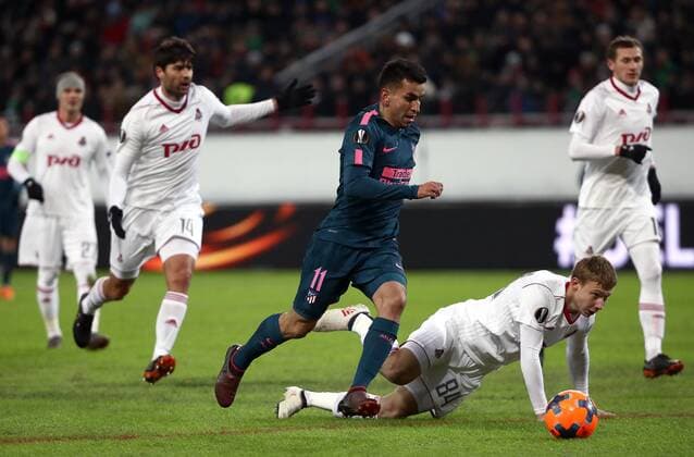 MOSCOW, RUSSIA - MARCH 15, 2018: Atletico Madrid s Angel Correa and Lokomotiv Moscow s Mikhail Lysov (L-R front) in action in their 2017-2018 UEFA Europa League Round of 16 second leg football match at RZD Arena (Lokomotiv Stadium). Valery Sharifulin TASS  TS077E0B