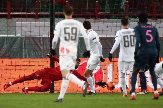 MOSCOW, RUSSIA - MARCH 15, 2018: Lokomotiv Moscow s goalkeeper Anton Kochenkov (background) concedes a goal in the 2017-2018 UEFA Europa League Round of 16 second leg football match against Atletico Madrid at RZD Arena (Lokomotiv Stadium). Valery Sharifulin TASS  TS077E15