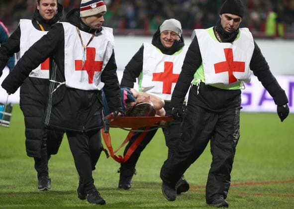 MOSCOW, RUSSIA - MARCH 15, 2018: Medical workers carry Atletico Madrid s Felipe Luis injured in the 2017-2018 UEFA Europa League Round of 16 second leg football match against Lokomotiv Moscow at RZD Arena (Lokomotiv Stadium). Valery Sharifulin TASS  TS077E2F