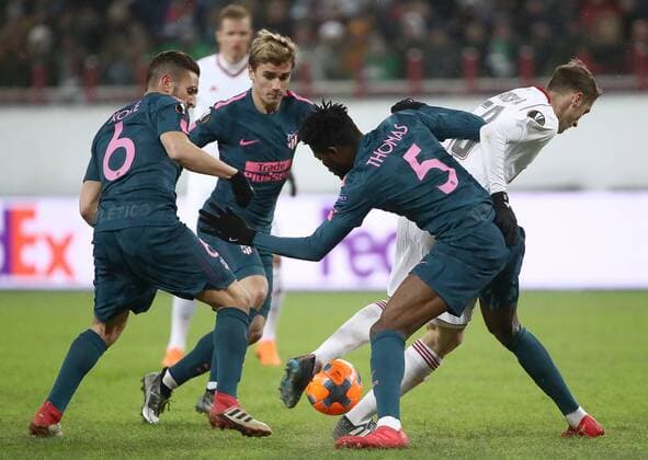 MOSCOW, RUSSIA - MARCH 15, 2018: Atletico Madrid s Koke and Thomas Teye Partey (L-R front) in action in the 2017-2018 UEFA Europa League Round of 16 second leg football match against Lokomotiv Moscow at RZD Arena (Lokomotiv Stadium). Valery Sharifulin TASS  TS077E40