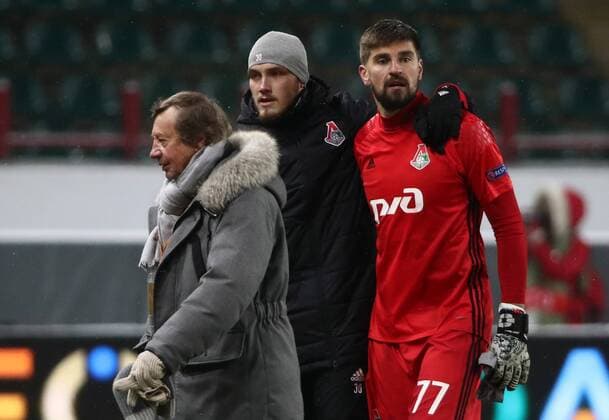 MOSCOW, RUSSIA - MARCH 15, 2018: Lokomotiv Moscow s manager Yuri Syomin and Lokomotiv Moscow s Nikita Medvedev, goalkeeper Anton Kochenkov (L-R) seen after the 2017-2018 UEFA Europa League Round of 16 second leg football match against Atletico Madrid at RZD Arena (Lokomotiv Stadium). Atletico Madrid won the game 5-1. Valery Sharifulin TASS  TS077E42