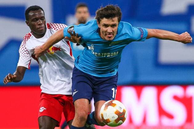ST PETERSBURG, RUSSIA - MARCH 15, 2018: RB Leipzig s Bruma (L) and Zenit St Petersburg s Yuri Zhirkov in action in their 2017-2018 UEFA Europa League Round of 16 second leg football match at Saint Petersburg Stadium. Peter Kovalev TASS  TS077E5C