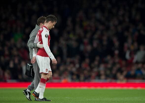 Laurent Koscielny of Arsenal walks off injured during the UEFA Europa League round of 16 2nd leg match between Arsenal and AC Milan at the Emirates Stadium, London, England on 15 March 2018. Copyright: xVincexxMignottx PMI-1884-0005