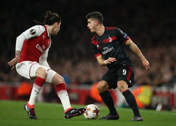 15th March 2018, Emirates Stadium, London, England; UEFA Europa League football, round of 16 second leg, Arsenal versus AC Milan; Hector Bellerin of Arsenal puts pressure on Andre Silva of AC Milan  ActionPlus12001809
