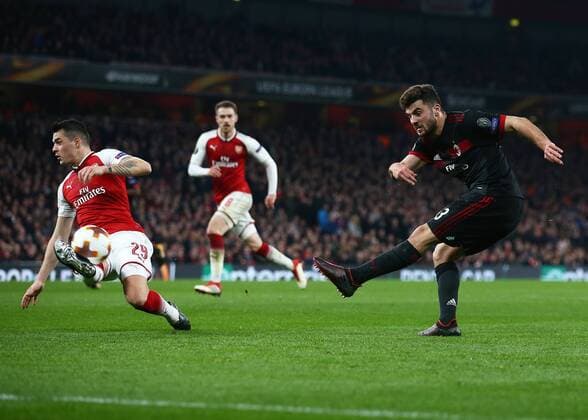 15th March 2018, Emirates Stadium, London, England; UEFA Europa League football, round of 16 second leg, Arsenal versus AC Milan; Patrick Cutrone of AC Milan takes a shot past Granit Xhaka of Arsenal  ActionPlus12001819