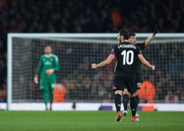Hakan Çalhano?lu of AC Milan celebrates scoring the opening goal during the UEFA Europa League round of 16 2nd leg match between Arsenal and AC Milan at the Emirates Stadium, London, England on 15 March 2018. Copyright: xVincexxMignottx PMI-1884-0013