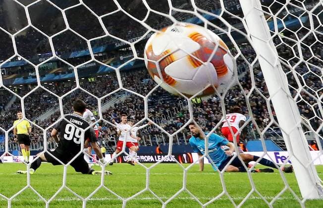 ST PETERSBURG, RUSSIA - MARCH 15, 2018: Zenit St Petersburg s goalkeeper Andrei Lunyov concedes a goal in the 2017-2018 UEFA Europa League Round of 16 second leg football match against RB Leipzig at Saint Petersburg Stadium. The game ended in a 1-1 draw. Alexander Demianchuk TASS  TS077E7E