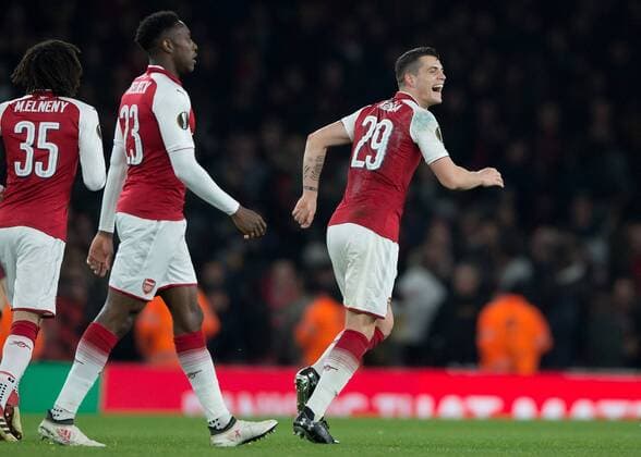 Granit?Xhaka of Arsenal celebrates scoring his sides second goal during the UEFA Europa League round of 16 2nd leg match between Arsenal and AC Milan at the Emirates Stadium, London, England on 15 March 2018. Copyright: xVincexxMignottx PMI-1884-0015