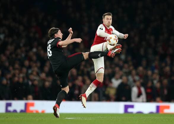 15th March 2018, Emirates Stadium, London, England; UEFA Europa League football, round of 16 second leg, Arsenal versus AC Milan; Aaron Ramsey of Arsenal and Riccardo Montolivo of AC Milan compete for the ball  ActionPlus12001852
