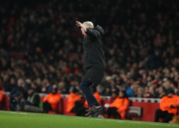 15th March 2018, Emirates Stadium, London, England; UEFA Europa League football, round of 16 second leg, Arsenal versus AC Milan; Arsenal manager Arsene Wenger jumping in the air and shouting at his players from the touchline  ActionPlus12001856