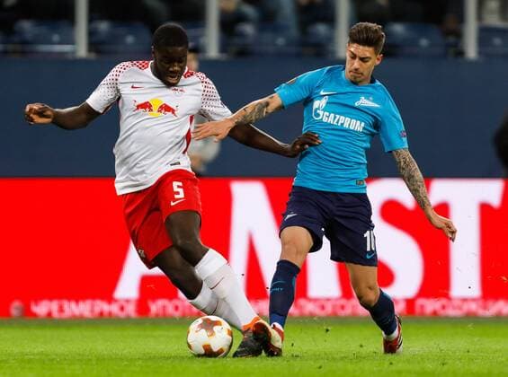 March 15, 2018 - Saint Petersburg, Russia - Emiliano Rigoni (R) of FC Zenit Saint Petersburg and Dayot Upamecano of RB Leipzig vie for the ball during the UEFA Europa League Round of 16 second leg match between FC Zenit St. Petersburg and RB Leipzig at Saint Petersburg Stadium on March 15, 2018 in Saint Petersburg, Russia. Zenit St Petersburg v RB Leipzig - UEFA Europa League Round of 16: Second Leg  - ZUMAn230 20180315_zaa_n230_437 Copyright: xMikexKireevx
